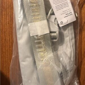 Lululemon Athletica Cream Crossbody Bag with Gold Accents